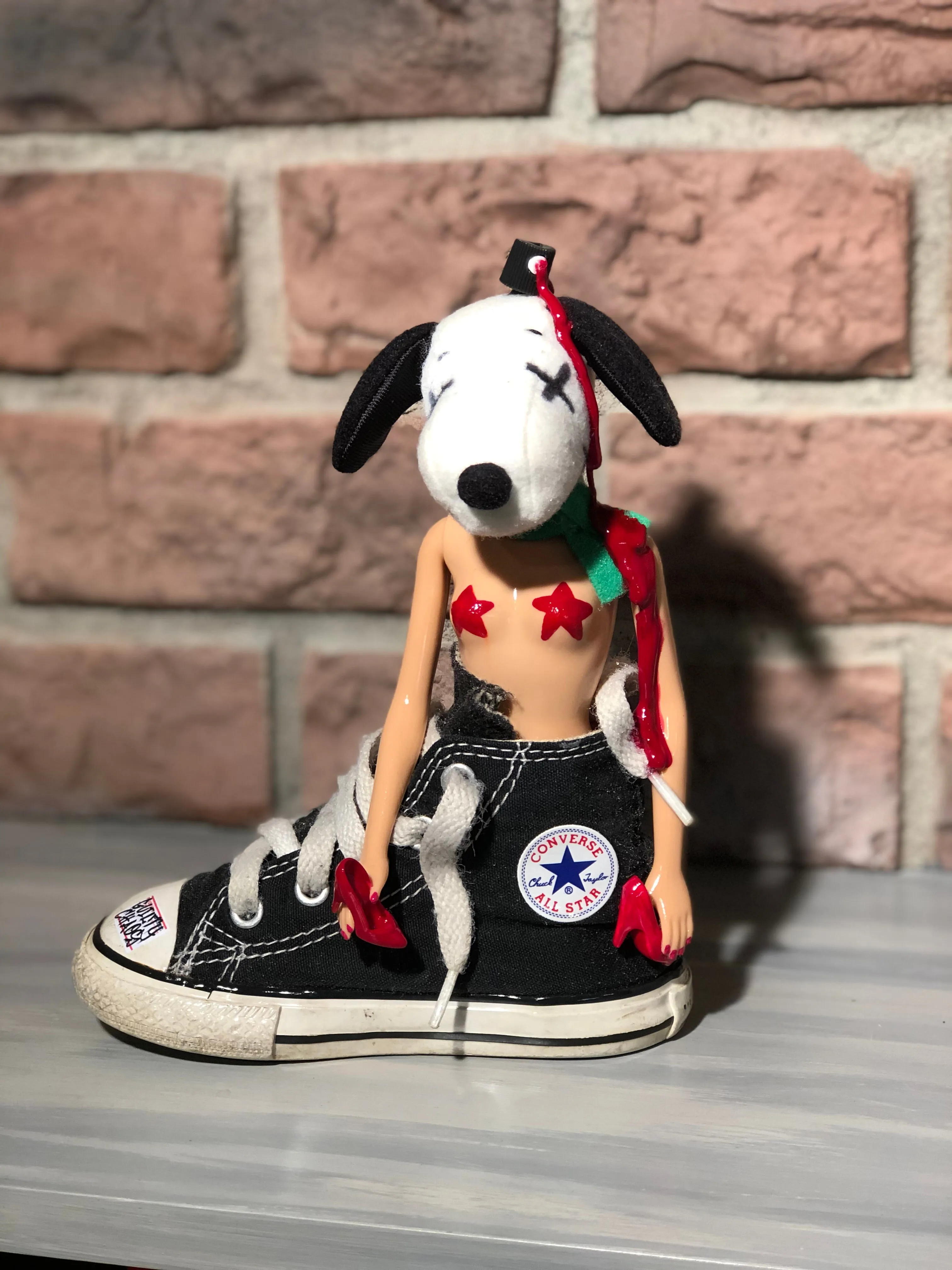 Kaws Snoopy can rock chucks or heels