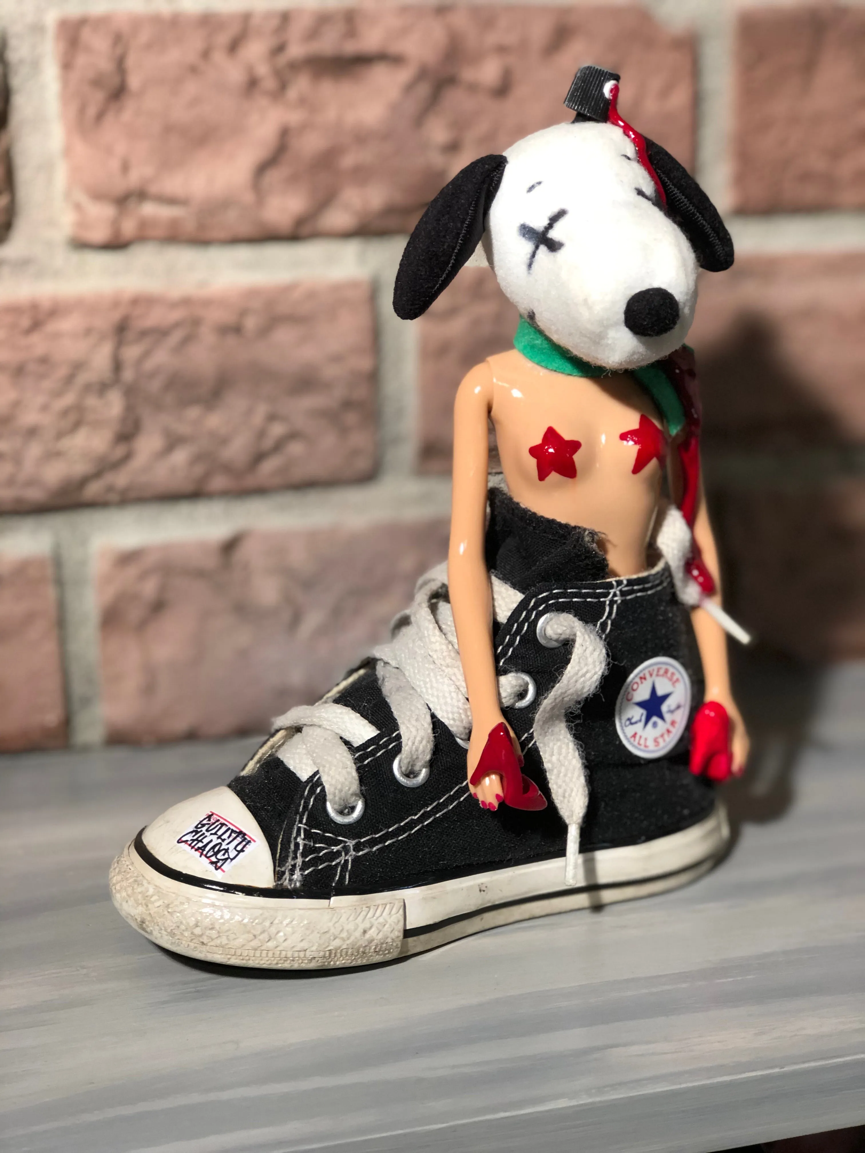 Kaws Snoopy can rock chucks or heels